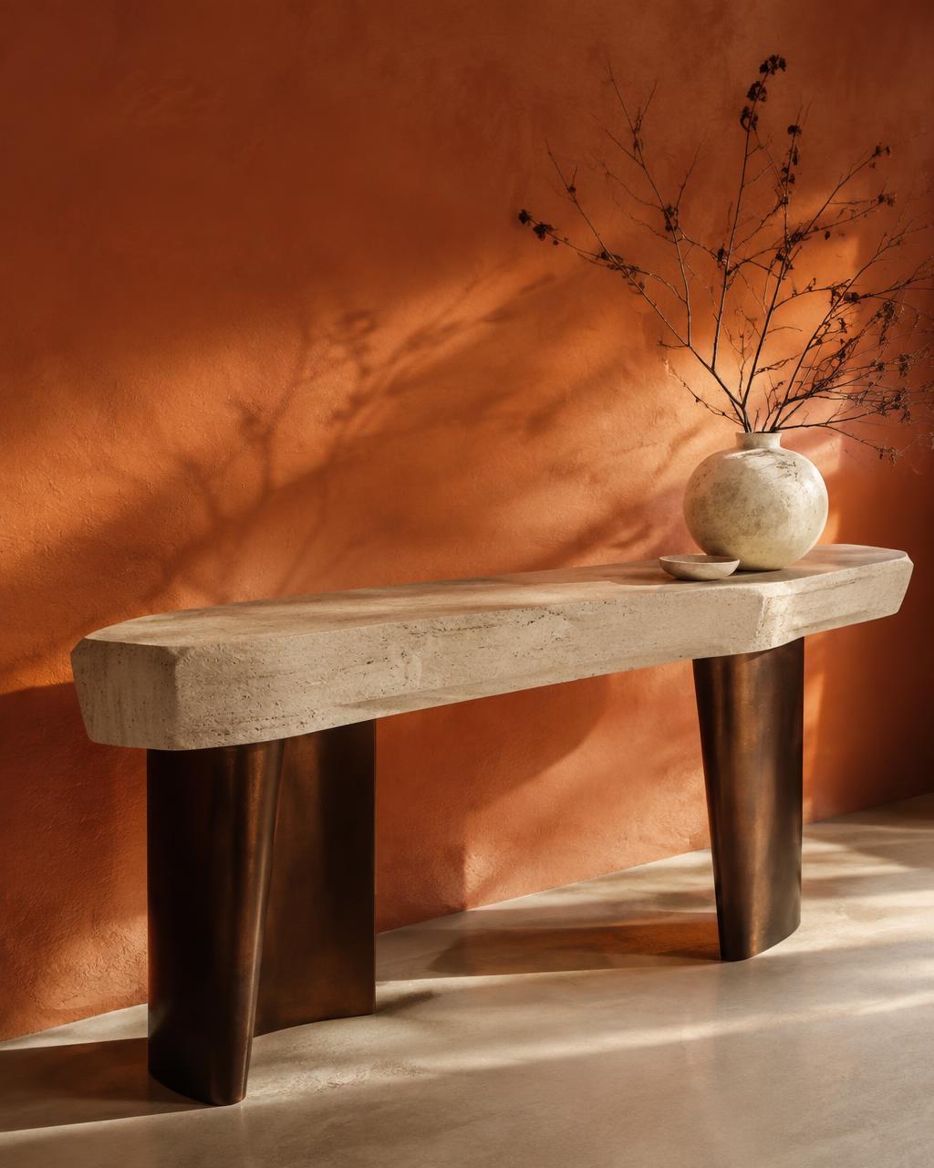 The Sahara Console in Honed travertine · Bronzed brass